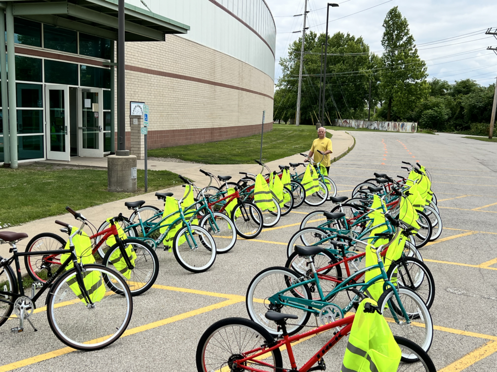 Around two dozen bikes and reflecting vests lined up