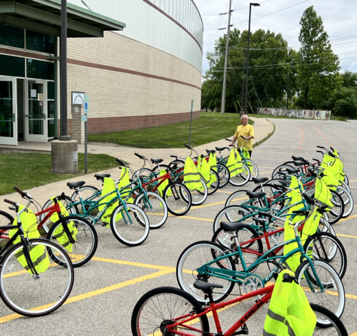 Around two dozen bikes and reflecting vests lined up