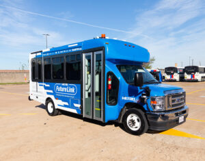 A blue Houston METRO AV Futurelink Shuttle Bus
