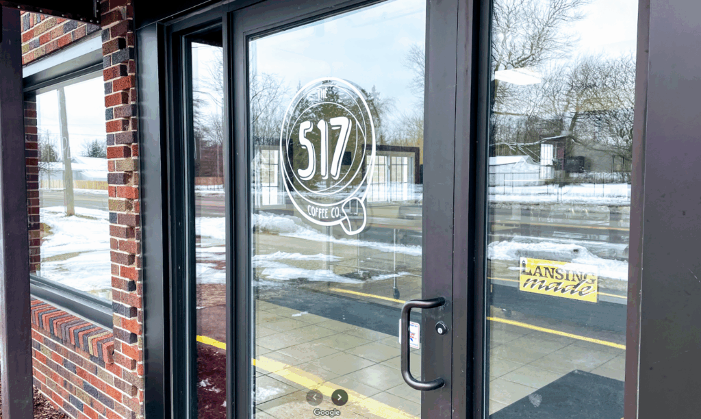 Glass doors with a logo showing 517 Coffee Co. on it