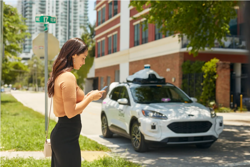 Image of a customer and a Lyft AV