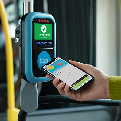 Image of customer paying for Big Blue Bus fare by tapping mobile wallet to TAP validator