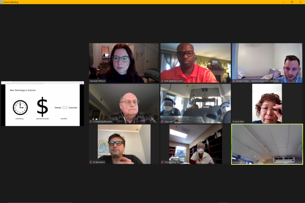 Picture of a Zoom meeting with a slide from the presentation and nine images of different people on the Zoom meeting. Leadership Group members met on different CPACS Shuttles with translators.