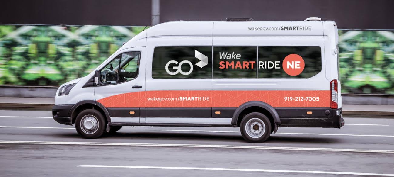 A Go Wake Van drives on the road. 