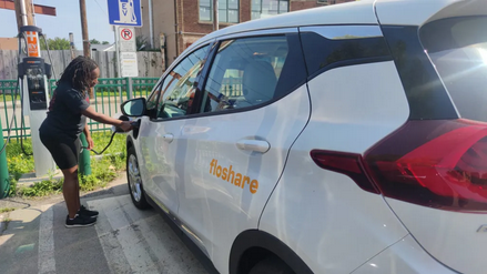 Imaging of person charging Floshare car