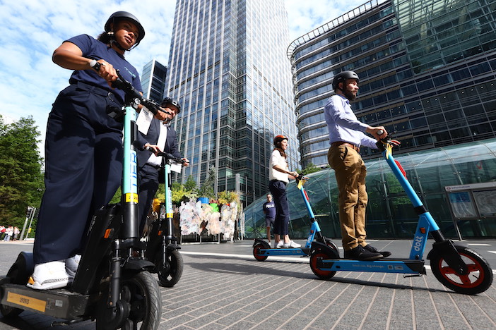 Image of people riding TIER and Dott e-scooters