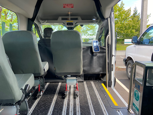 Image showing how vans were retrofitted with seats, Smart Card reader, and farebox.