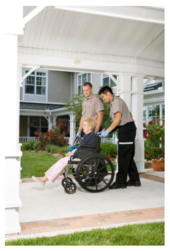 A picture of two transportation employees helping an elderly woman out of her house and to a medical appointment.