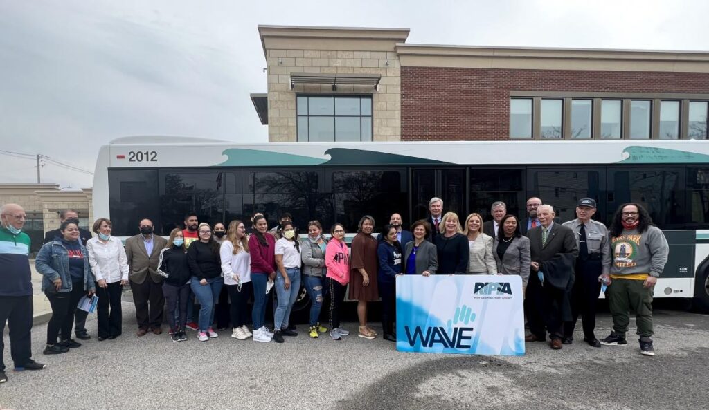 Program Stakeholders standing in front of RITPA bus