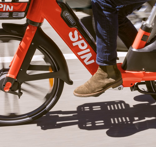 Image of person riding Spin electric bike