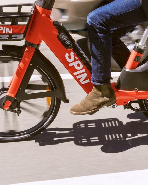 Image of person riding Spin electric bike