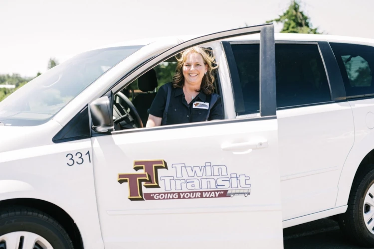 A driver in a Twin Transit Vehicle