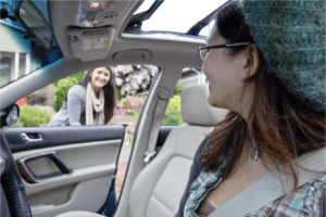 A female entering a carpool vehicle