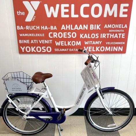 Image of a Cycle Sandusky County bike in front of a YMCA Welcome sign