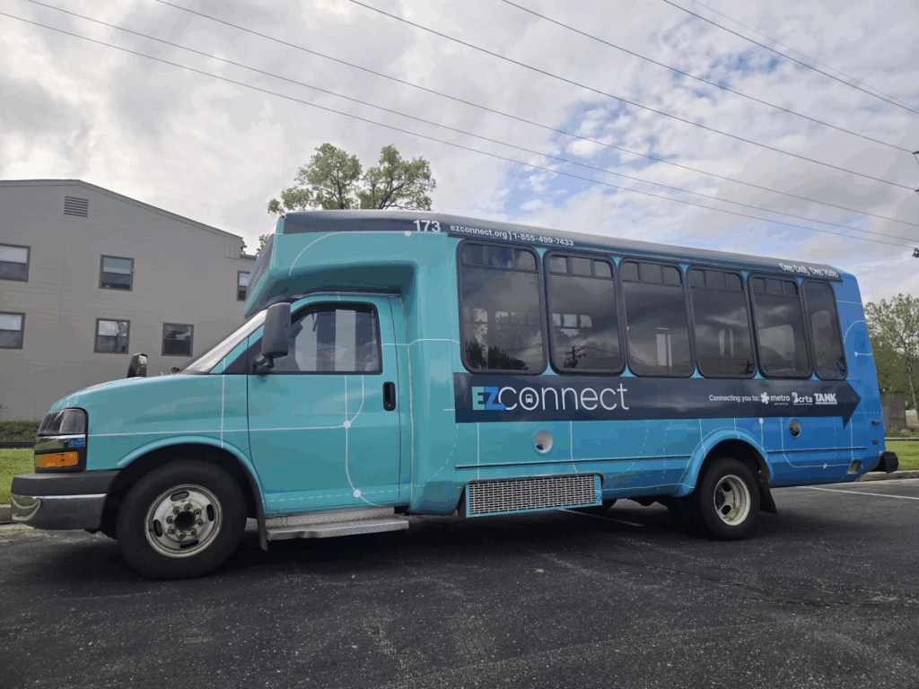 a light blue bus with the word EZConnect written on the side