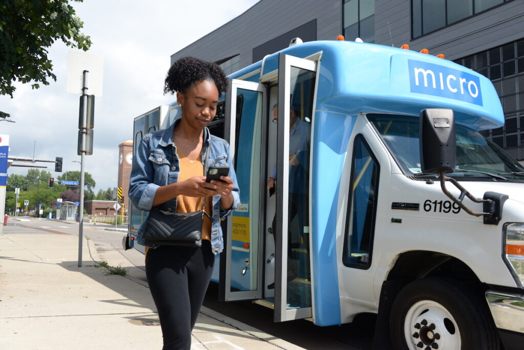 Woman exiting a Metro Transit micro minibus