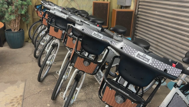 9 bikeshare bikes lined up next to each other